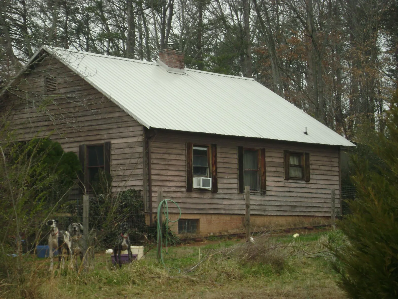 White metal roof on an old wood sided farmhouse, from a Metal Roof Installation job in Mount Croghan